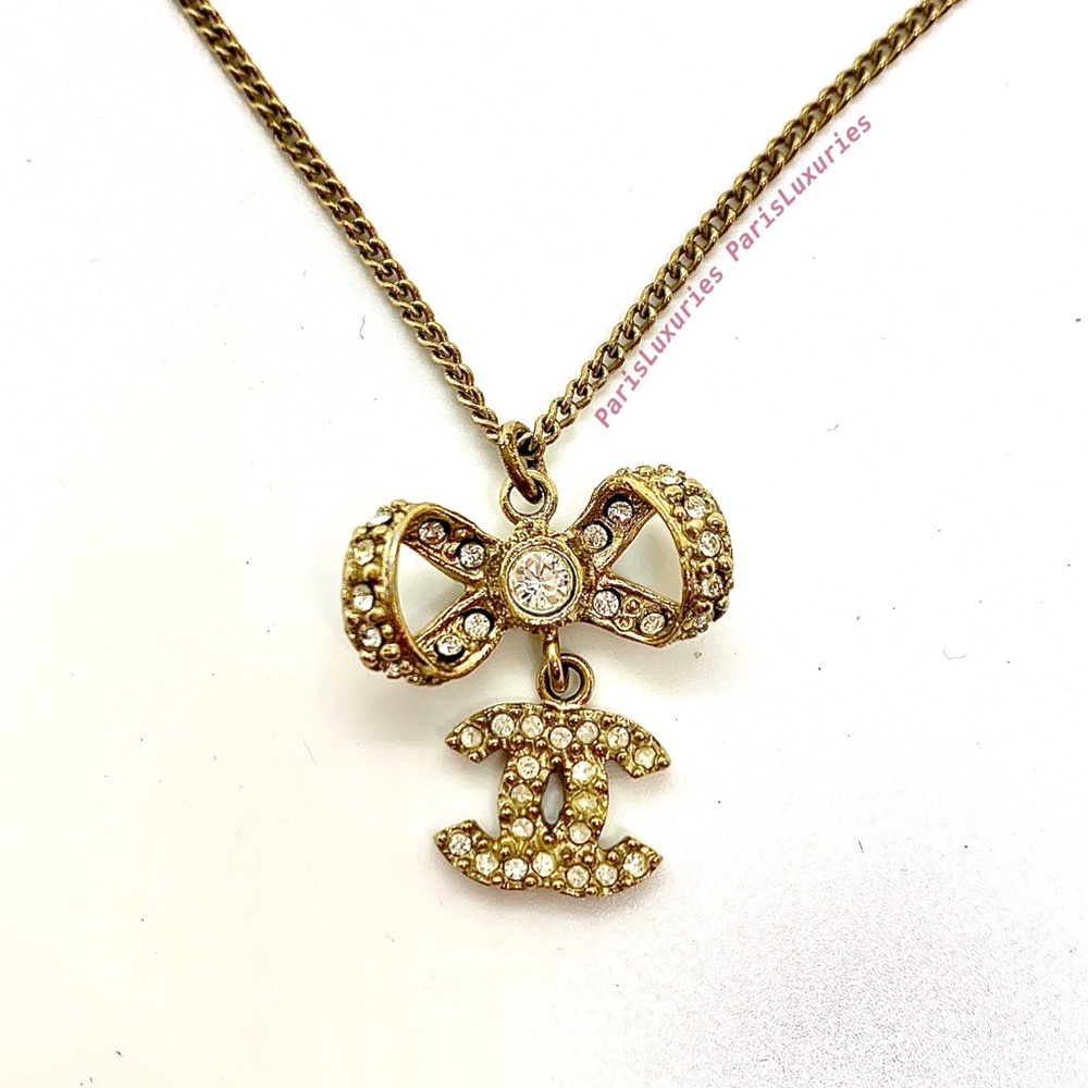 CHANEL Gold CC Logo Rhinestone Ribbon Bow Pendant
